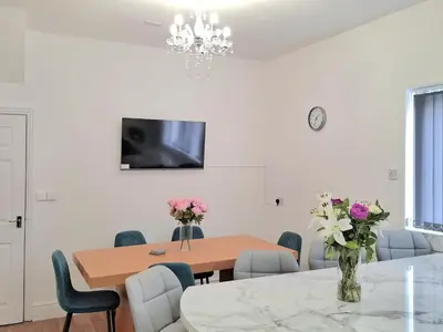 a dining room with a table and chairs at Amazing Central House in Blackpool
