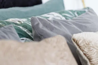 a bed with a blanket and pillows on it at Charming 4BR House in St Helens - Sleep 8 in Saint Helens