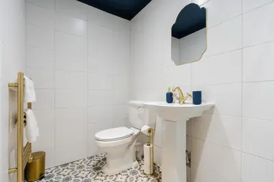 a bathroom with a white toilet and a sink at RST Bramley Boutique in Liverpool