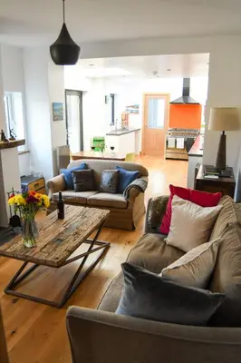 a living room with two couches and a table at Foundry View in Millom