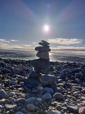 a stack of rocks on a rocky beach at Seaview home in Baycliff, Cumbria in Baycliff