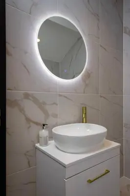 a bathroom with a white sink and a mirror at Stylish 4-Bed House Central Blackpool Family Stay in Blackpool