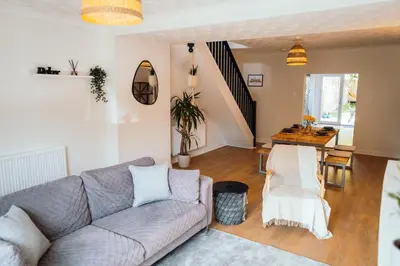 a living room with a couch and a table at Bradley's Hideaway With Private Garden in Eccleston