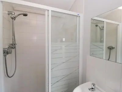 a bathroom with a shower and a sink at Sunset Retreat in Carnforth