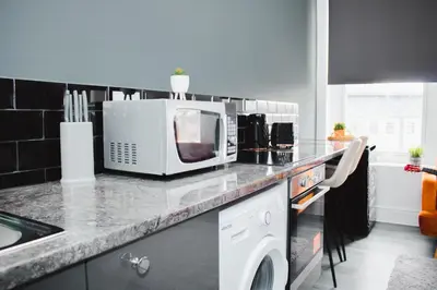 a kitchen with a counter top with a microwave at Contractor Studio - Liverpool L5 - Sleeps 3 in Liverpool