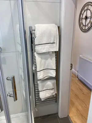 a towel rack with towels in a bathroom at The Fortress in Lytham St Annes