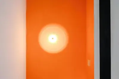 an orange wall with a light on it at #17 Walk to Anfield Stylish House for 12 in Liverpool