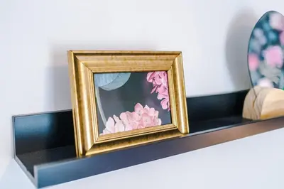 a picture of pink flowers on a shelf at #17 Walk to Anfield Stylish House for 12 in Liverpool