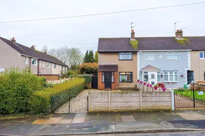 a house with a fence in front of it at New 2 Bed House - Perfect for Contractors & Families In St Helens Weekly & Monthly Stays in Saint Helens