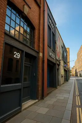 an empty street in a brick building with shops at Central Apt, Parking, Walk to Shops, Bars & Trains in Liverpool