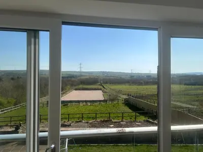a view of a field from a window at Oswaldtwistle Farmhouse in Oswaldtwistle