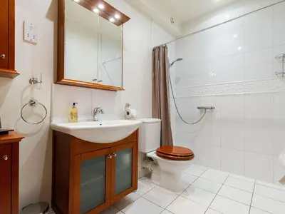 a bathroom with a sink and a toilet and a shower at Wolfen Mill in Preston