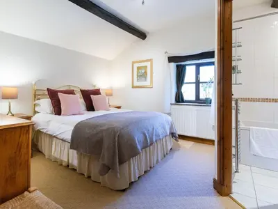 a bedroom with a bed and a window at Wolfen Mill in Preston