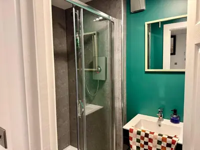 a bathroom with a shower and a sink at Three-Bedroom Superior Apartment - Sleeps 6 in Southport