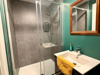 a bathroom with a shower and a sink at Three-Bedroom Superior Apartment - Sleeps 6 in Southport