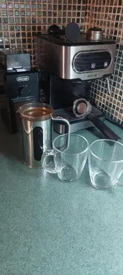 a counter with three glass bowls and a toaster oven at Home in Liverpool in Liverpool