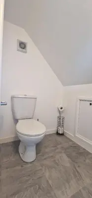 a bathroom with a white toilet in a room at Holiday home in Poulton le Fylde