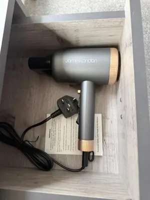a flashlight in a wooden box with a charger at 61 Moorfields city centre apartment sleeps 10 in Liverpool