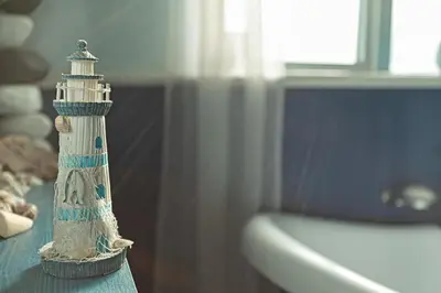 a toy lighthouse sitting on top of a table at Smithy Cottage in Heysham