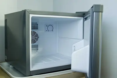 an empty refrigerator with its door open in a kitchen at Rossall Guest House Blackpool - Ideal For Families & Couples in Blackpool