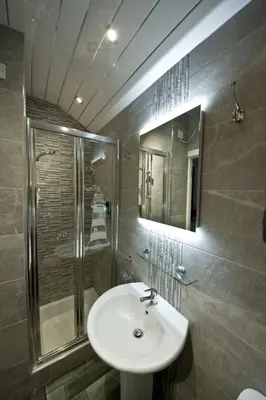 a bathroom with a sink and a shower at Rossall Guest House Blackpool - Ideal For Families & Couples in Blackpool