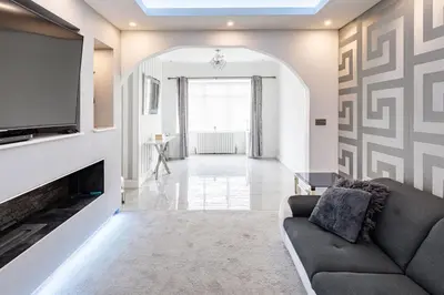 a living room with a couch and a tv at Lux nights away in Cleveleys