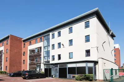 a white building with a black roof at Prospect Point in Liverpool in Liverpool