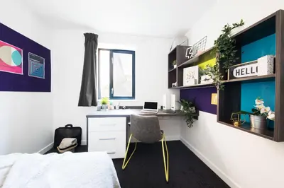 a bedroom with a desk with a laptop on it at Prospect Point in Liverpool in Liverpool