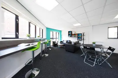 an office with tables and chairs and a couch at Prospect Point in Liverpool in Liverpool