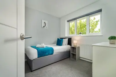 a bedroom with a bed and a window at The Acorn Nook - Central Stay in Liverpool