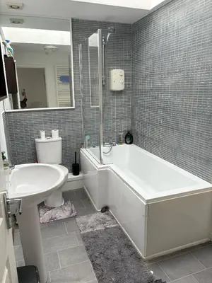 a bathroom with a tub and a toilet and a sink at Liberty Guest House in Liverpool