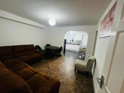 a living room with a couch and a table at Liberty Guest House in Liverpool