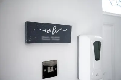 a sign that reads will hanging on a wall at Bolton Retreat Modern 3BR Home Pool Table & Parking Sleeps 6 in Bolton