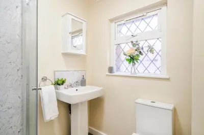 a bathroom with a sink and a window at Long-Term Work Stay 20 Percent OFF Fully Equipped & Central Location in Horwich
