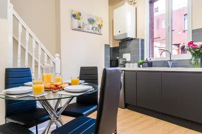 a kitchen and dining room with a glass table and chairs at Long-Term Work Stay 20 Percent OFF Fully Equipped & Central Location in Horwich