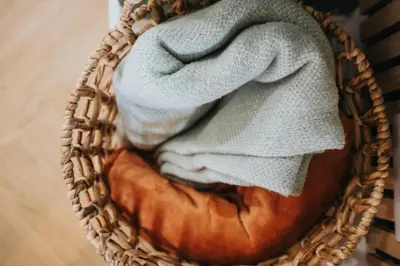 a wicker basket filled with a pile of towels at 10 Min to Beach Cheap Taxi to City FreeParking in Liverpool