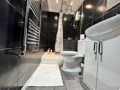 a bathroom with a sink and a toilet and a shower at Room 3 Shared House in L6 in Liverpool