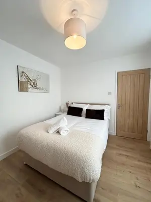 a white bedroom with a bed and a ceiling at Lytham House Retreat - Free Parking in Marton