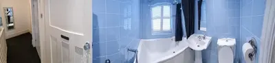 a blue bathroom with a sink and a toilet at Beautiful Residential Within Easy Reach of Town in Haydock