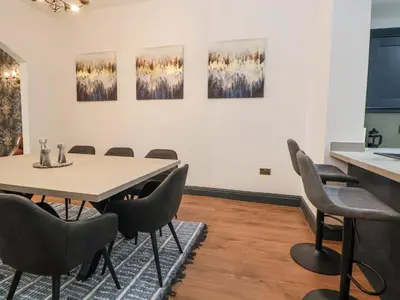 a conference room with a table and chairs at The Alhambra in Southport