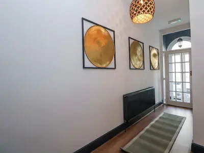 a living room with four pictures on the wall at The Alhambra in Southport