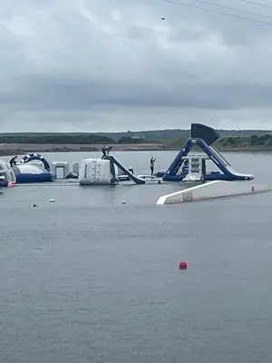 a group of boats sitting in the water at 148 Port Haverigg in Millom