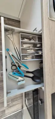 a drawer filled with scissors and other kitchen utensils at Apartment 5 in Blackpool