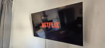a flat screen tv hanging on a wall at Apartment 5 in Blackpool