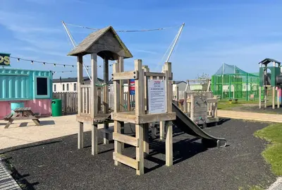 a playground with a slide in a park at The Dean's on the Lune in Heysham