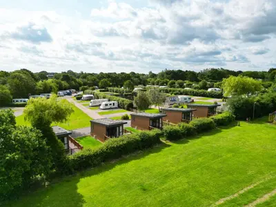 an aerial view of a park with parked vehicles at Royal Umpire Caravan Park in Croston