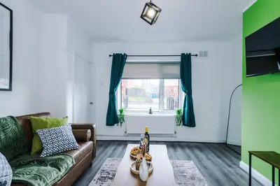 a living room with a couch and a window at Acacia Lodge Retreat - Beautiful & Modern 3-BR with Wi-Fi by Parydise Properties in Shevington