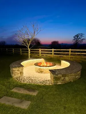 a fire pit in the middle of a yard at Ribble Valley Hideaways in Preston