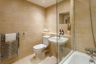 a bathroom with a toilet and a shower and a sink at Prime City Centre Living Large 2 Bed 2 Bath Free Netflix Sleeps 7 in Liverpool
