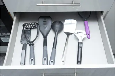 a drawer filled with spatulas and other kitchen utensils at Anfield Escape in Liverpool